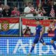 Croatia's Andrej Kramaric, left, celebrates with teammates after scoring the opening goal during a World Cup 2026 group L qualifying soccer match between Croatia and Czech Republic at the Opus Arena in Osijek, Croatia, Monday, June 9, 2025. (AP Photo/Darko Bandic)