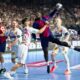 Magdeburg's Antonio Serradilla Cuenca, third left, tries to prevent Barcelona's Rok Ovnicek from taking a shot during the Champions League handball game, semi-final, between FC Barcelona and SC Magdeburg at Lanxess Arena in Cologne, Germany, Saturday June 14, 2025. (Marius Becker/dpa via AP)
