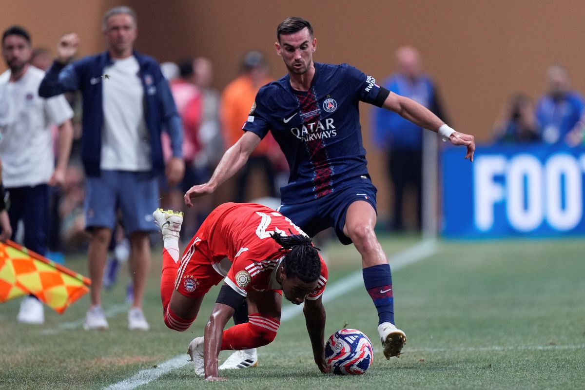 Bayern Munich's Michael Olise is fouled by Paris Saint-Germain's Fabian Ruiz during the Club World Cup quarterfinal soccer match between PSG and Bayern Munich in Atlanta, Saturday, July 5, 2025. (AP Photo/Mike Stewart)