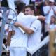 Novak Djokovic of Serbia, left, greets Miomir Kecmanovic of Serbia after winning their third round men's singles match at the Wimbledon Tennis Championships in London, Saturday, July 5, 2025. (AP Photo/Kirsty Wigglesworth)