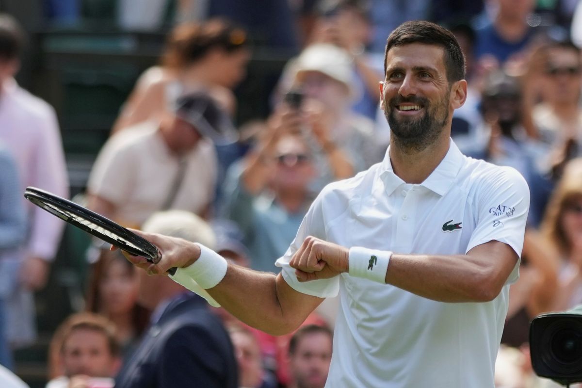 Novak Djokovic of Serbia reacts after beating Daniel Evans of Britain during their second round men's singles match at the Wimbledon Tennis Championships in London, Thursday, July 3, 2025. (AP Photo/Alastair Grant)