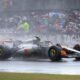 McLaren driver Lando Norris of Britain steers his car as it rains during the British Formula One Grand Prix race at the Silverstone racetrack in Silverstone, England, Sunday, July 6, 2025. (AP Photo/Darko Bandic)