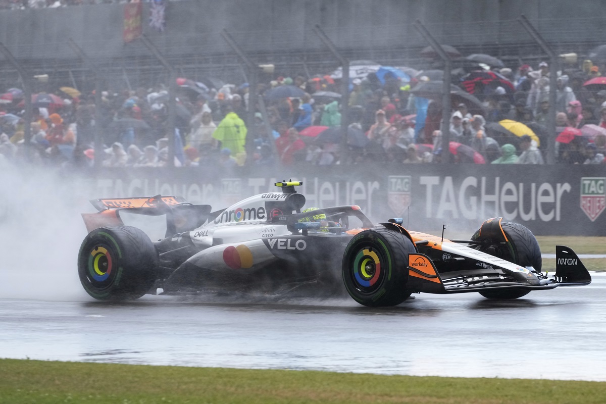 McLaren driver Lando Norris of Britain steers his car as it rains during the British Formula One Grand Prix race at the Silverstone racetrack in Silverstone, England, Sunday, July 6, 2025. (AP Photo/Darko Bandic)