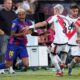 Barcelona's Lamine Yamal, left, is challenged by Rayo's Pep Chavarria during the Spanish La Liga soccer match between Rayo Vallecano and FC Barcelona at the Vallecas stadium in Madrid, Spain, Sunday, Aug. 31, 2025. (AP Photo/Manu Fernandez)