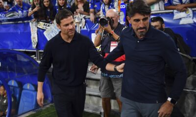 Real Madrid's head coach Xabi Alonso, left, greets Oviedo's coach Veljko Paunovic prior to a Spanish La Liga soccer match between Real Oviedo and Real Madrid at Carlos Tartiere stadium in Oviedo, Spain, Sunday, Aug. 24, 2025. (AP Photo/Miguel Oses)