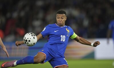France's Kylian Mbappe kicks the ball during a World Cup Group D qualifying soccer match between France and Iceland at the Parc des Princes stadium in Paris, Tuesday, Sept. 9, 2025. (AP Photo/Christophe Ena)