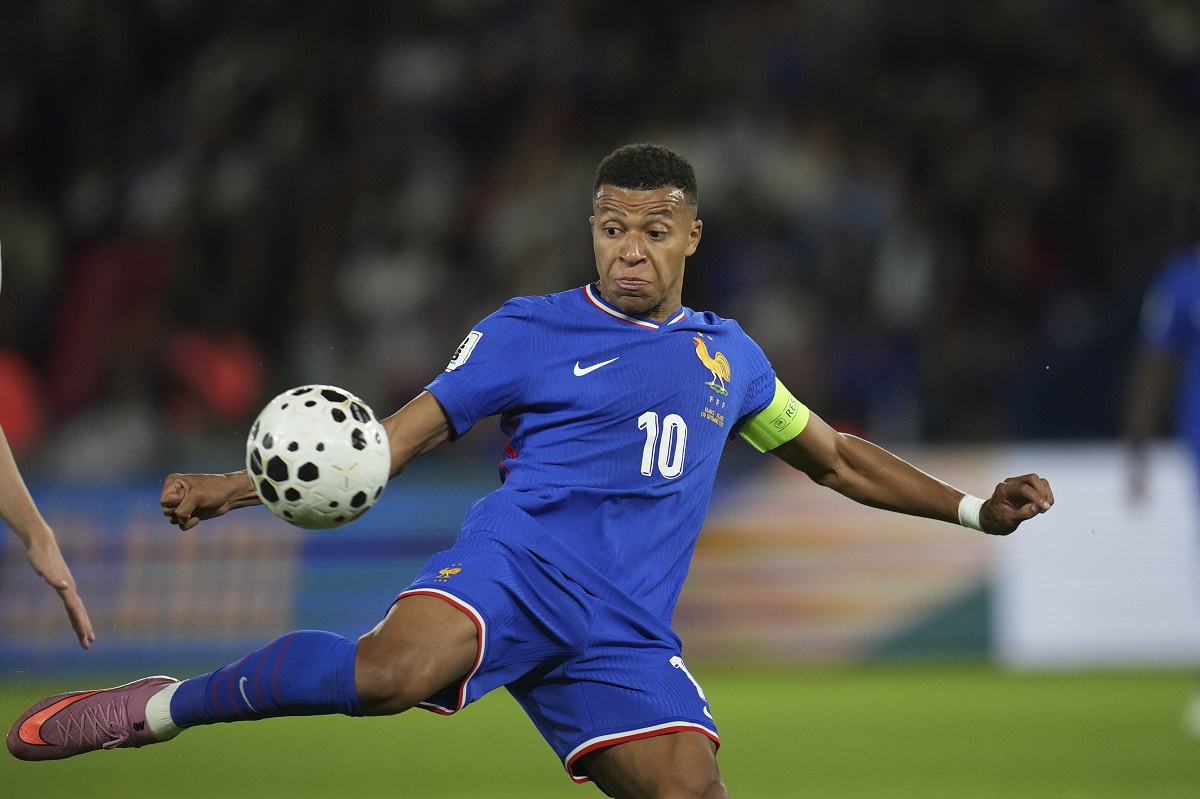 France's Kylian Mbappe kicks the ball during a World Cup Group D qualifying soccer match between France and Iceland at the Parc des Princes stadium in Paris, Tuesday, Sept. 9, 2025. (AP Photo/Christophe Ena)
