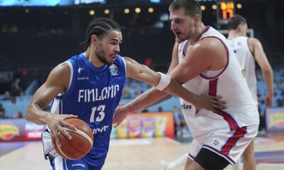 Finland's Olivier Nkamhoua, left, and Serbia's Nikola Jokic in action during the Eurobasket, European Basketball Championship round of 16 match between Serbia and Finland at the Riga Arena in Riga, Latvia, Saturday, Sept. 6, 2025. (AP Photo/Sergei Grits)
