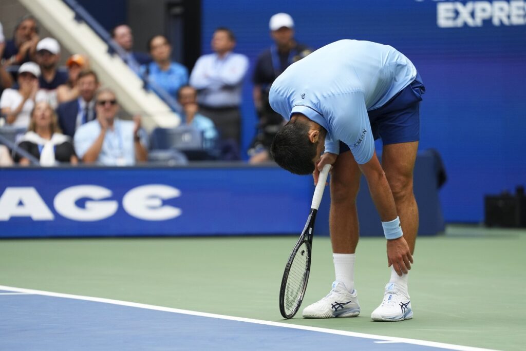 Novak Djokovic, of Serbia, reacts after losing a point to Carlos Alcaraz, of Spain, during the men's singles semifinals of the U.S. Open tennis championships, Friday, Sept. 5, 2025, in New York. (AP Photo/Kirsty Wigglesworth)