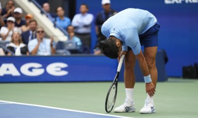 Novak Djokovic, of Serbia, reacts after losing a point to Carlos Alcaraz, of Spain, during the men's singles semifinals of the U.S. Open tennis championships, Friday, Sept. 5, 2025, in New York. (AP Photo/Kirsty Wigglesworth)