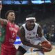 Germany's Isaac Bonga, right, and Portugal's Travante Williams in action during the Eurobasket, European Basketball Championship round of 16 match between Germany and Portugal at the Riga Arena in Riga, Latvia, Saturday, Sept. 6, 2025. (AP Photo/Sergei Grits)