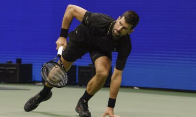Novak Djokovic, of Serbia, chases down a shot form Jan-Lennard Struff, of Germany, during the fourth round of the US Open tennis championships, Sunday, Aug. 31, 2025, in New York. (AP Photo/Adam Hunger)