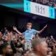 A Manchetser City fan reacts after a first goal during the Premier League soccer match between Manchester City and Manchester United in Manchester, England, Sunday, Sept. 14, 2025. (AP Photo/Dave Thompson)