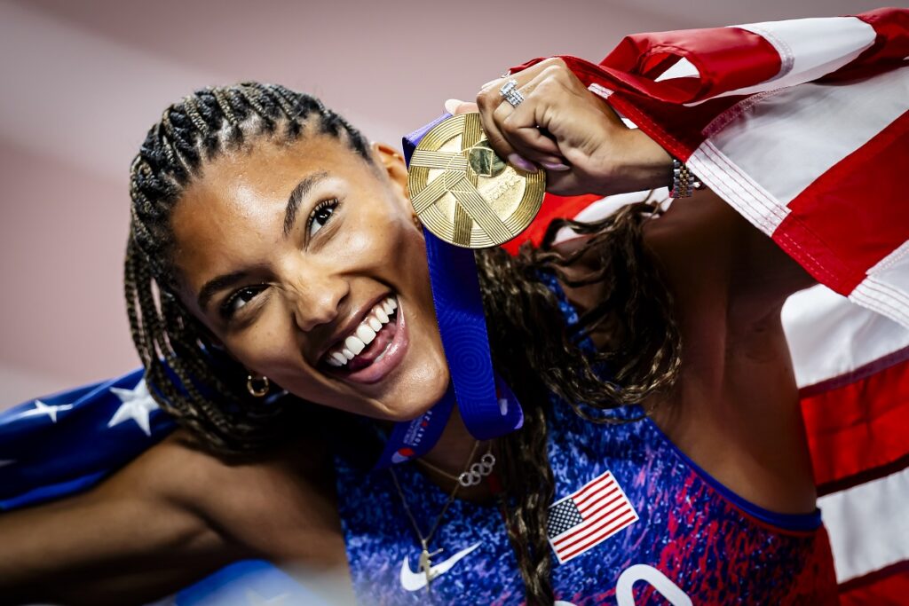 United States' Tara Davis-Woodhall celebrates after winning the gold medal in the women's long jump final at the World Athletics Championships in Tokyo, Sunday, Sept. 14, 2025. (Michael Buholzer, Keystone via AP)