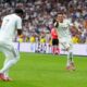 Real Madrid's Kylian Mbappe, right, celebrates with Vinicius Junior after scoring his side's second goal during the Spanish La Liga soccer match between Real Madrid and Espanyol at the Santiago Bernabeu stadium in Madrid, Spain, Saturday, Sept. 20, 2025. (AP Photo/Manu Fernandez)