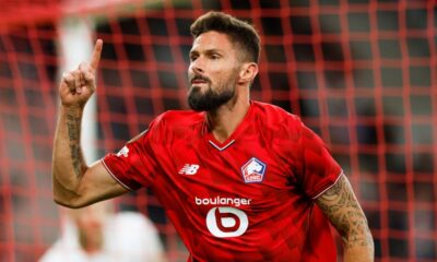 Llle's Olivier Giroud celebrates after scoring his sides second goal during the Europa League soccer match between Lille and Brann at the Pierre Mauroy stadium in Villeneuve d'Ascq, northern France, Thursday, Sept. 25, 2025. (AP Photo/Jean-Francois Badias)