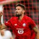 Llle's Olivier Giroud celebrates after scoring his sides second goal during the Europa League soccer match between Lille and Brann at the Pierre Mauroy stadium in Villeneuve d'Ascq, northern France, Thursday, Sept. 25, 2025. (AP Photo/Jean-Francois Badias)