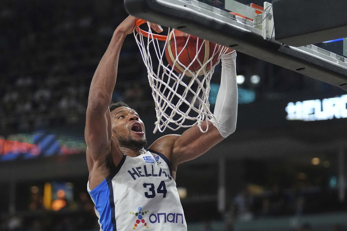 Greece's Giannis Antetokounmpo scores during the Eurobasket, European Basketball Championship third place match between Greece and Finland at the Riga Arena in Riga, Latvia, Sunday, Sept. 14, 2025. (AP Photo/Sergei Grits)