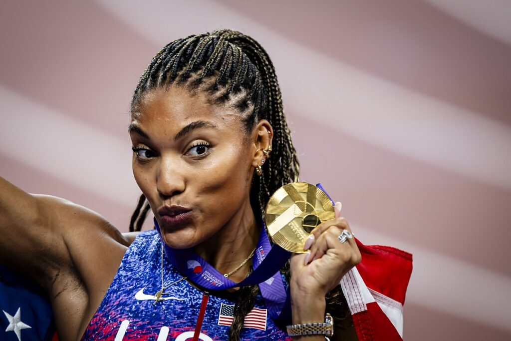 United States' Tara Davis-Woodhall celebrates after winning the gold medal in the women's long jump final at the World Athletics Championships in Tokyo, Sunday, Sept. 14, 2025. (Michael Buholzer, Keystone via AP)