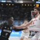 Germany's Dennis Schroder, left, drives to the basket as Turkey's Alperen Sengun tries to block him during the Eurobasket, European Basketball Championship final match between Turkey and Germany at the Riga Arena in Riga, Latvia, Sunday, Sept. 14, 2025. (AP Photo/Sergei Grits)