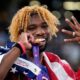 United States' Noah Lyles poses after winning the gold medal in the men's 200 meters final at the World Athletics Championships in Tokyo, Friday, Sept. 19, 2025. (AP Photo/Matthias Schrader)
