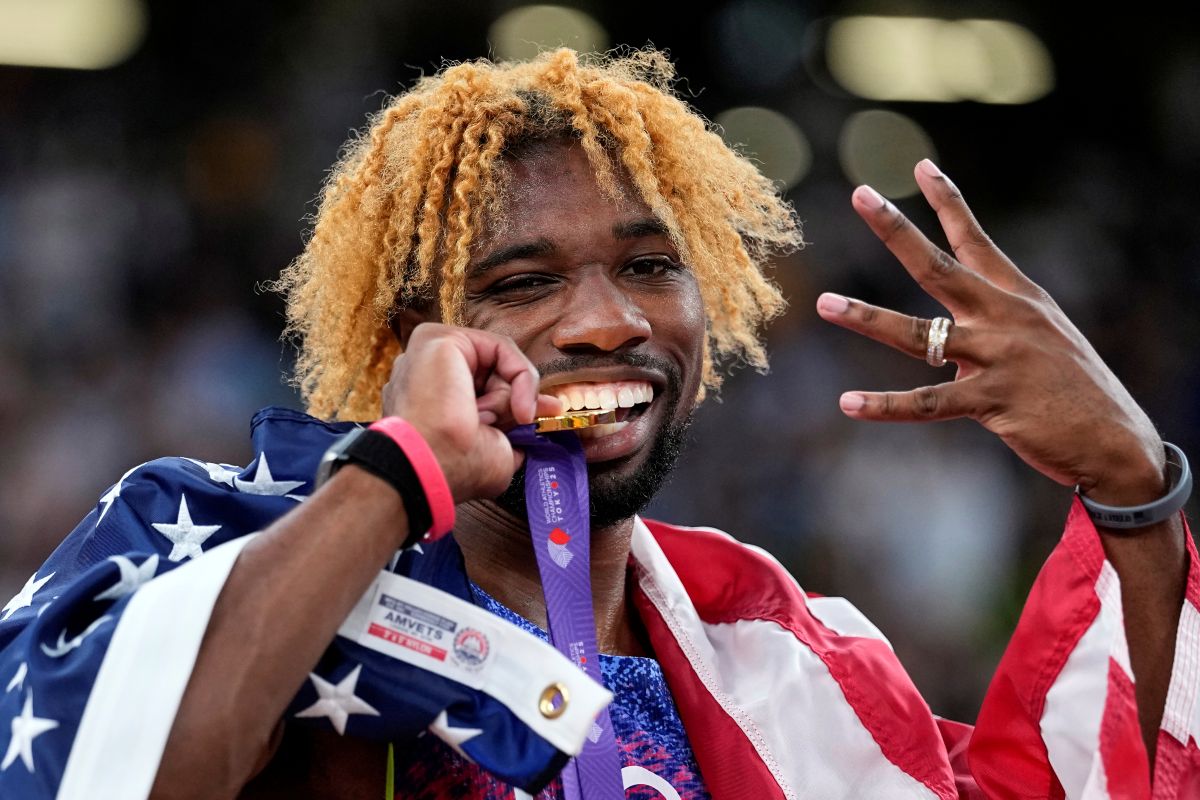 United States' Noah Lyles poses after winning the gold medal in the men's 200 meters final at the World Athletics Championships in Tokyo, Friday, Sept. 19, 2025. (AP Photo/Matthias Schrader)