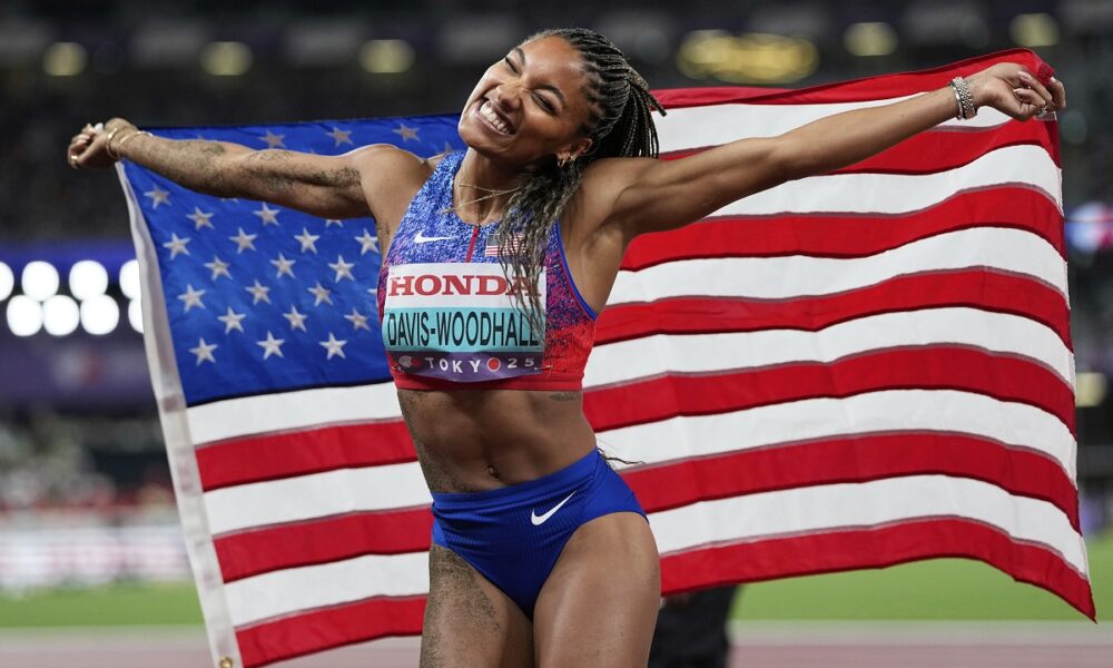 United States' Tara Davis-Woodhall reacts after winning the gold medal in the women's long jump final at the World Athletics Championships in Tokyo, Sunday, Sept. 14, 2025. (AP Photo/Ashley Landis)