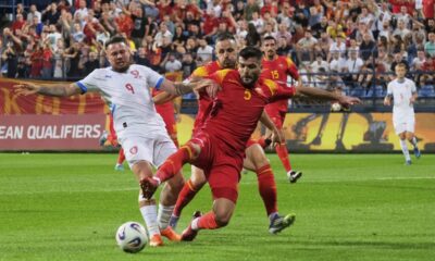 Czech Republic's Vasil Kusej, left, and Montenegro's Igor Vujacic fight for the ball during a World Cup 2026 group L qualifying soccer match between Montenegro and Czech Republic at the City Stadium, in Podgorica, Montenegro, Friday, Sept. 5, 2025. (AP Photo/Risto Bozovic)