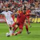 Czech Republic's Vasil Kusej, left, and Montenegro's Igor Vujacic fight for the ball during a World Cup 2026 group L qualifying soccer match between Montenegro and Czech Republic at the City Stadium, in Podgorica, Montenegro, Friday, Sept. 5, 2025. (AP Photo/Risto Bozovic)