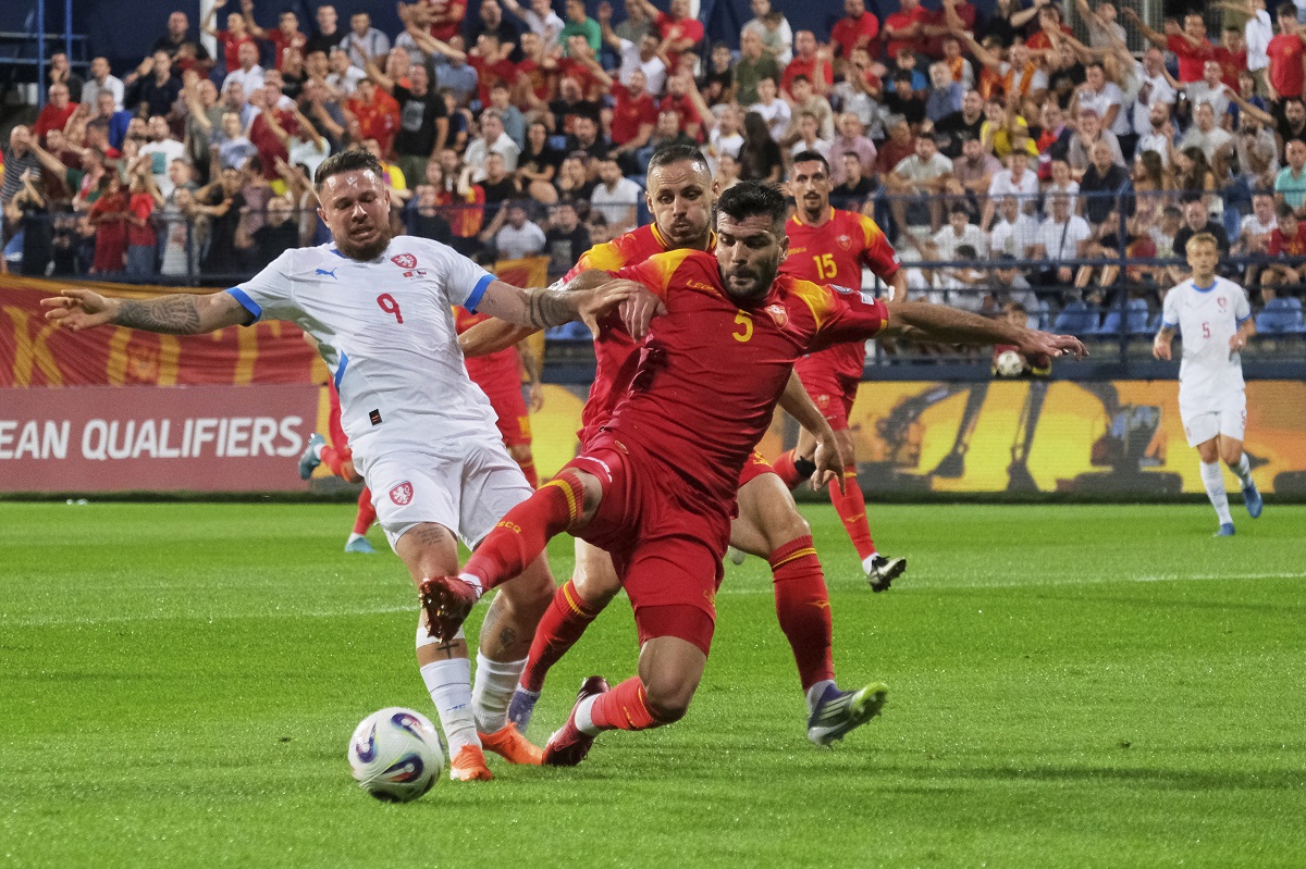Czech Republic's Vasil Kusej, left, and Montenegro's Igor Vujacic fight for the ball during a World Cup 2026 group L qualifying soccer match between Montenegro and Czech Republic at the City Stadium, in Podgorica, Montenegro, Friday, Sept. 5, 2025. (AP Photo/Risto Bozovic)