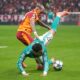 Galatasaray's Lucas Torreira, left, and Liverpool's Curtis Jones fight for the ball during the Champions League opening phase soccer match between Galatasaray and Liverpool at the Ali Sami Yen stadium, in Istanbul, Turkey, Tuesday, Sept. 30, 2025. (AP Photo/Francisco Seco)