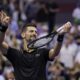 Novak Djokovic, of Serbia, pretends to play the violin after defeating Jan-Lennard Struff, of Germany, during the fourth round of the US Open tennis championships, Sunday, Aug. 31, 2025, in New York. (AP Photo/Adam Hunger)