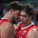 Turkey's Alperen Sengun, left, and Turkey's Cedi Osman celebrate after scoring during the Eurobasket, European Basketball Championship semi-final match between Greece and Turkey at the Riga Arena in Riga, Latvia, Friday, Sept. 12, 2025. (AP Photo/Sergei Grits)