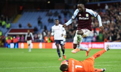 Bologna's goalkeeper Lukasz Skorupski makes a save in front of Aston Villa's Evann Guessand during the Europa League soccer match between Aston Villa and Bologna at Villa Park stadium in Birmingham, England, Thursday, Sept. 25, 2025. (AP Photo/Darren Staples)
