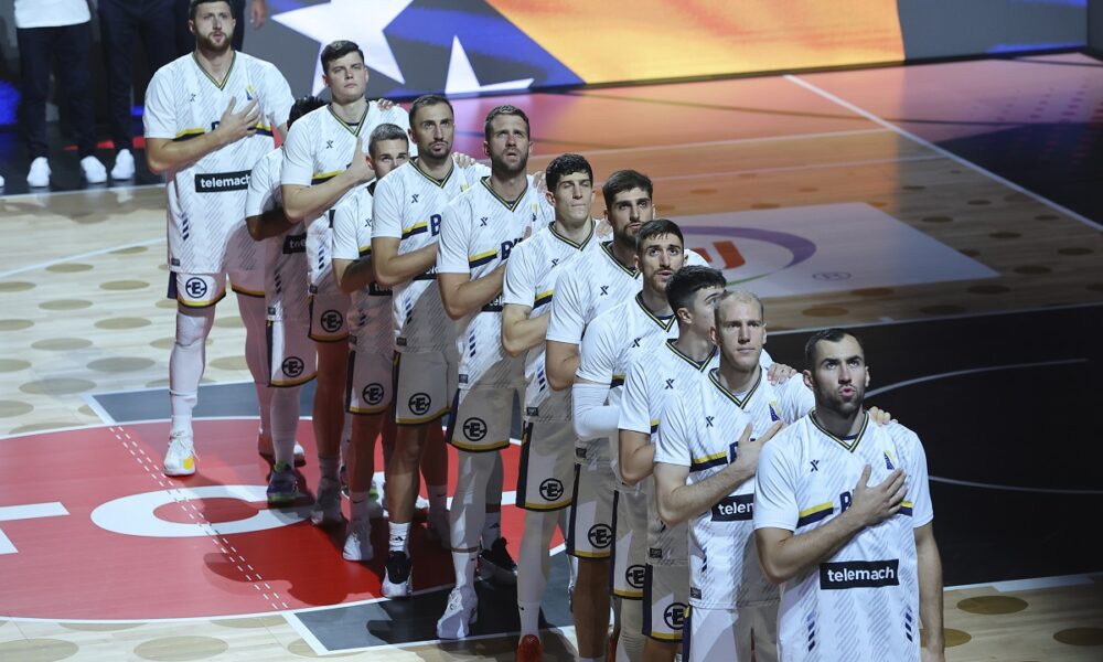 Players of Bosnia stand for their national anthem before the Eurobasket, European Basketball Championship Group C match between Bosnia and Georgia at Spyros Kyprianou Arena, in Limassol, Cyprus, Thursday, Sept. 4, 2025. (AP Photo/Sakis Savvides)
