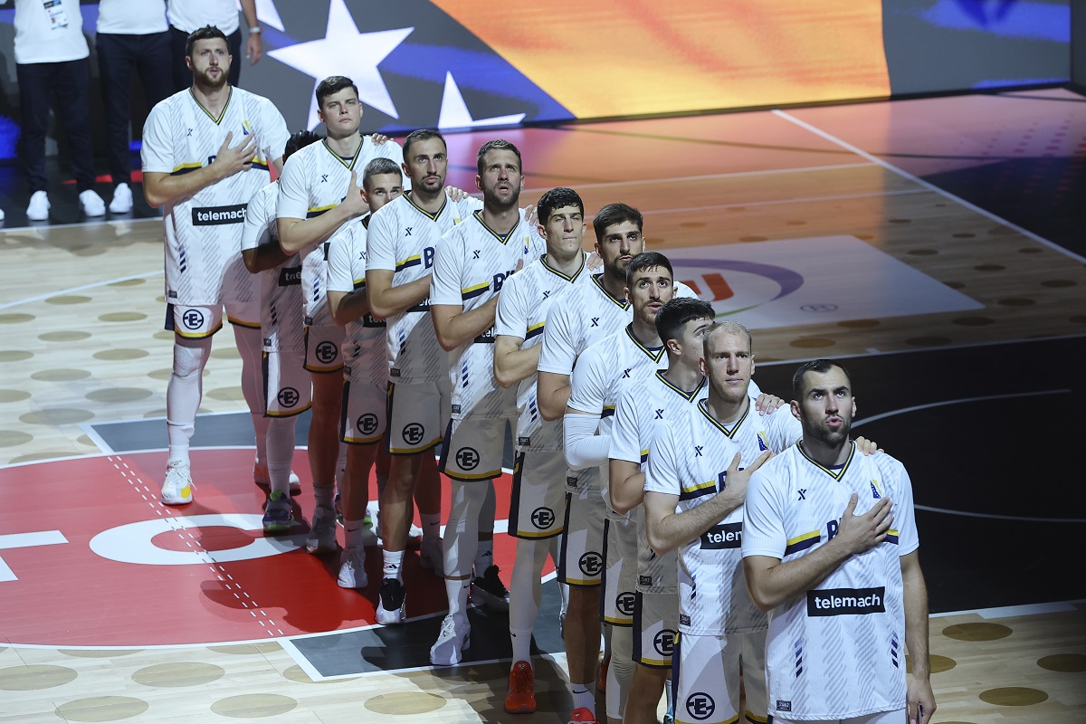 Players of Bosnia stand for their national anthem before the Eurobasket, European Basketball Championship Group C match between Bosnia and Georgia at Spyros Kyprianou Arena, in Limassol, Cyprus, Thursday, Sept. 4, 2025. (AP Photo/Sakis Savvides)