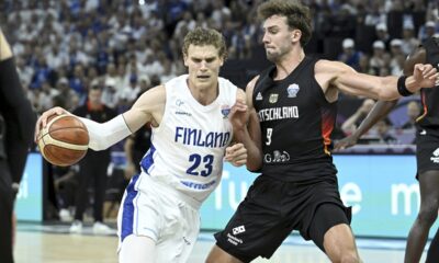 Finland's Lauri Markkanen with Germany's Franz Wagner, right, during the Eurobasket basketball match match between Finland and Germany in Tampere, Finland, Wednesday, Sept. 3, 2025. (Heikki Saukkomaa/Lehtikuva via AP)