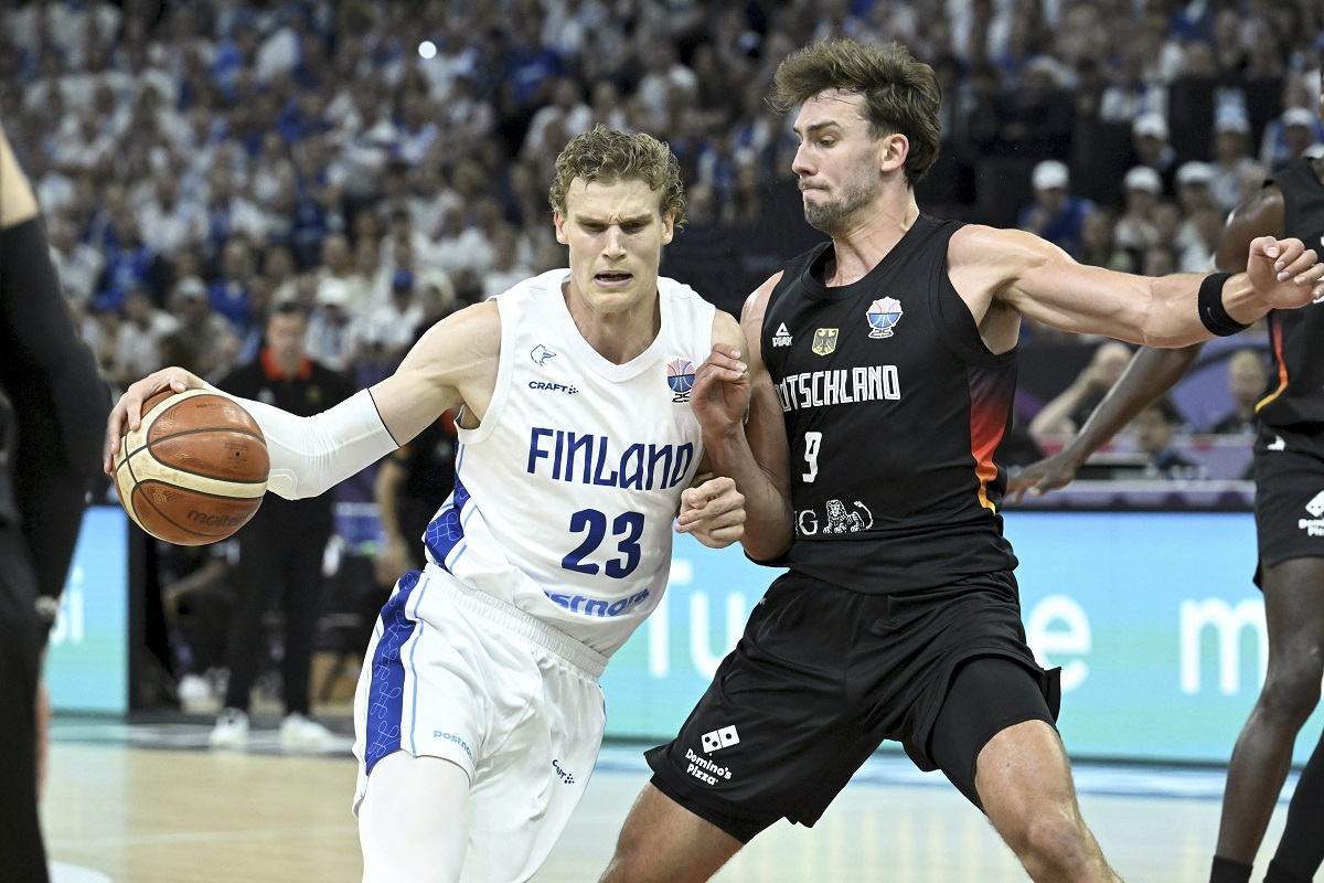 Finland's Lauri Markkanen with Germany's Franz Wagner, right, during the Eurobasket basketball match match between Finland and Germany in Tampere, Finland, Wednesday, Sept. 3, 2025. (Heikki Saukkomaa/Lehtikuva via AP)