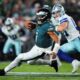 Philadelphia Eagles quarterback Jalen Hurts (1) runs the ball for a gain as Dallas Cowboys defensive end Donovan Ezeiruaku (41) gives chase in the first half of an NFL football game Thursday, Sept. 4, 2025, in Philadelphia. (AP Photo/Matt Slocum)