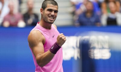 Carlos Alcaraz, of Spain, reacts after scoring a point against Jiri Lehecka, of the Czech Republic, during the quarterfinal round of the U.S. Open tennis championships, Tuesday, Sept. 2, 2025, in New York. (AP Photo/Kirsty Wigglesworth)