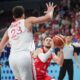 Poland's Mateusz Ponitka tries to shoot while defended by Turkey's Alperen Sengun during the Eurobasket, European Basketball Championship quarter final match between Turkey and Poland at the Riga Arena in Riga, Latvia, Tuesday, Sept. 9, 2025. (AP Photo/Sergei Grits)