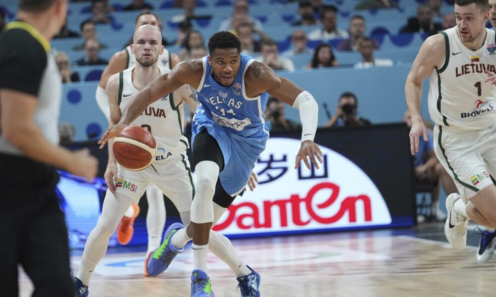 Greece's Giannis Antetokounmpo, centre, in action during the Eurobasket, European Basketball Championship quarter final match between Lithuania and Greece at the Riga Arena in Riga, Latvia, Tuesday, Sept. 9, 2025. (AP Photo/Sergei Grits)