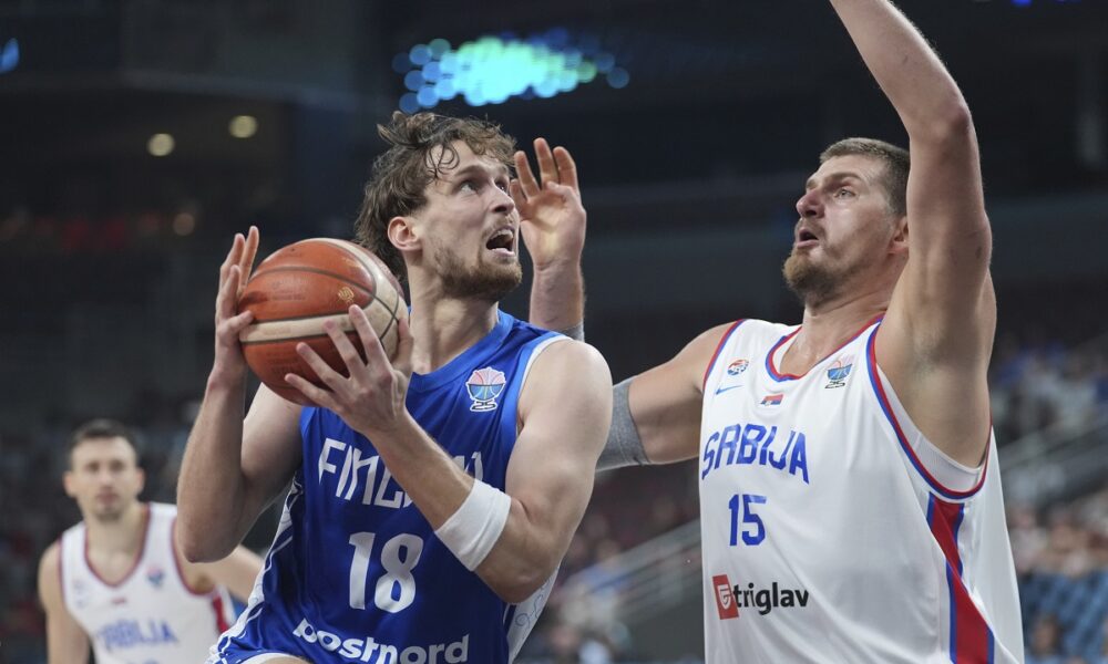 Finland's Mikael Jantunen, left, and Serbia's Nikola Jokic in action during the Eurobasket, European Basketball Championship round of 16 match between Serbia and Finland at the Riga Arena in Riga, Latvia, Saturday, Sept. 6, 2025. (AP Photo/Sergei Grits)