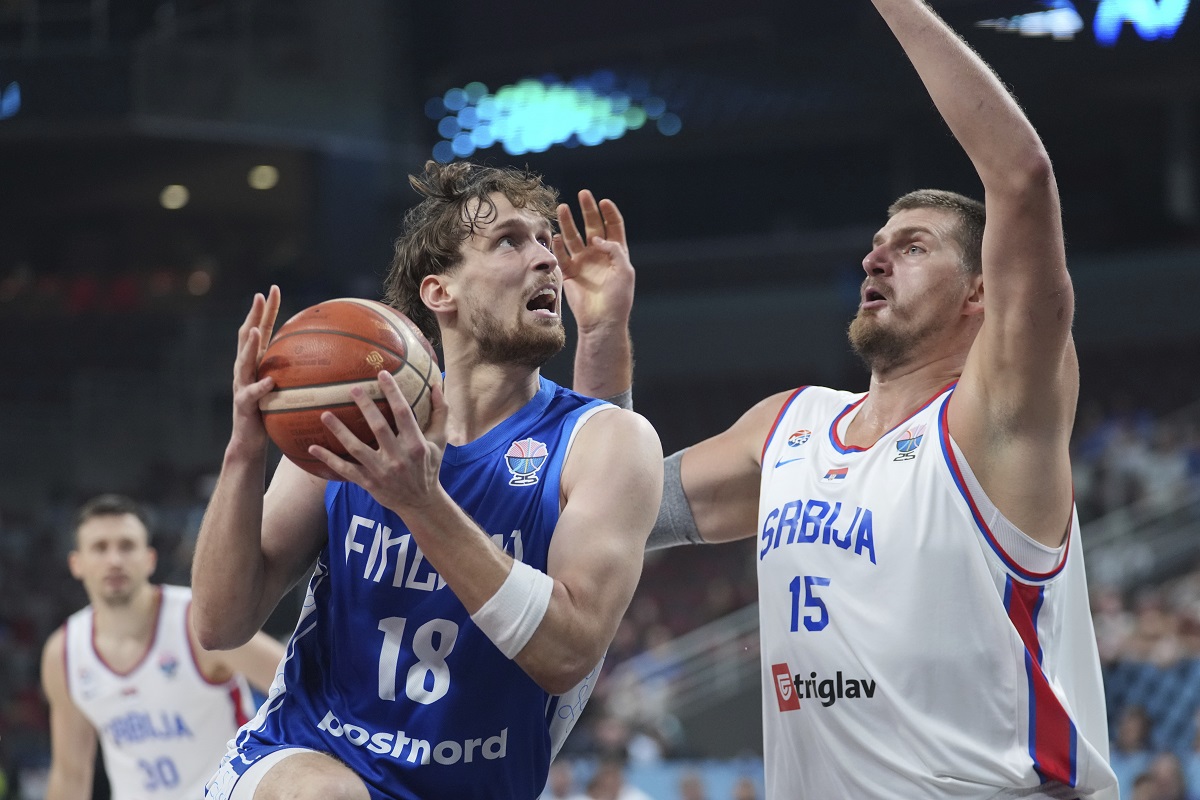 Finland's Mikael Jantunen, left, and Serbia's Nikola Jokic in action during the Eurobasket, European Basketball Championship round of 16 match between Serbia and Finland at the Riga Arena in Riga, Latvia, Saturday, Sept. 6, 2025. (AP Photo/Sergei Grits)