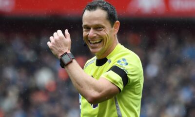 Referee Darren England smiles during the English Premier League soccer match between Liverpool and Everton at Anfield stadium in Liverpool, England, Saturday, Sept. 20, 2025. (AP Photo/Rui Vieira)