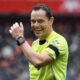 Referee Darren England smiles during the English Premier League soccer match between Liverpool and Everton at Anfield stadium in Liverpool, England, Saturday, Sept. 20, 2025. (AP Photo/Rui Vieira)