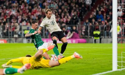 Bayern's Harry Kane, centre, fails to score during the Bundesliga soccer match between Bayern Munich and Werder Bremen at the Allianz Arena in Munich, Germany, Friday, Sept. 26, 2025. (AP Photo/Matthias Schrader)