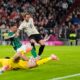 Bayern's Harry Kane, centre, fails to score during the Bundesliga soccer match between Bayern Munich and Werder Bremen at the Allianz Arena in Munich, Germany, Friday, Sept. 26, 2025. (AP Photo/Matthias Schrader)