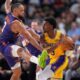 Los Angeles Lakers guard Bronny James, right, tries to pass while under pressure from Phoenix Suns forward Dillon Brooks during the second half of an NBA preseason basketball game Friday, Oct. 3, 2025, in Palm Desert, Calif. (AP Photo/Mark J. Terrill)