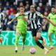 Newcastle United's Joelinton, right, and Fulham's Sasa Lukic in action during the English Premier League soccer match between Newcastle United and Fulham at St James' Park, Newcastle-upon-Tyne, England, Saturday Oct. 25, 2025. (Richard Sellers/PA via AP)